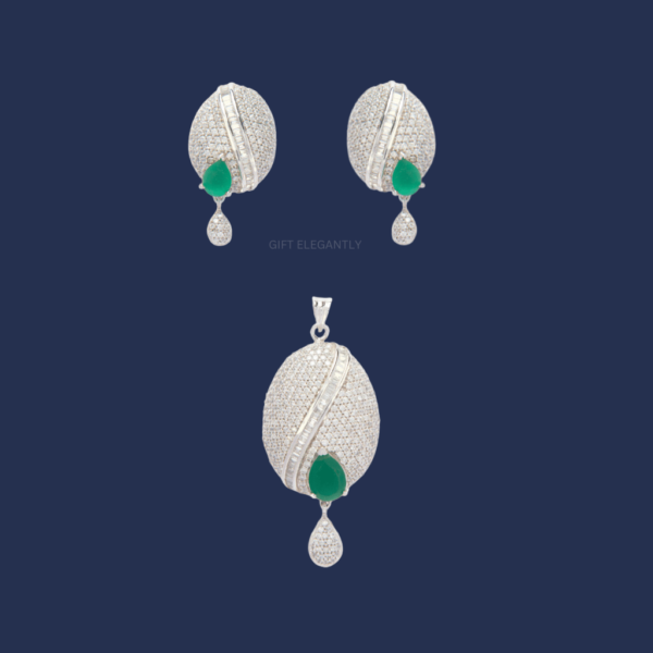 Gift Elegantly's Emerald Whisper Pendant Set features closely studded diamonds and a green stone, exuding elegance and sophistication.