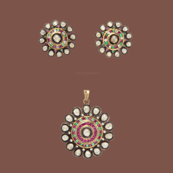 Radiant Blossom Pendant Set by Gift Elegantly features a round shape with polki at the center and red, green stones. A stunning choice for special occasions!