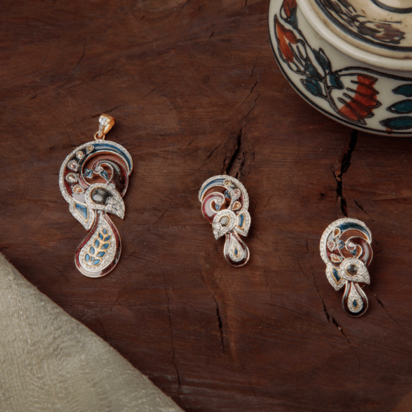 The Enchanted Peacock Pendant Set by Gift Elegantly features a peacock-shaped design with colorful enameling and diamond accents. Perfect for special occasions.