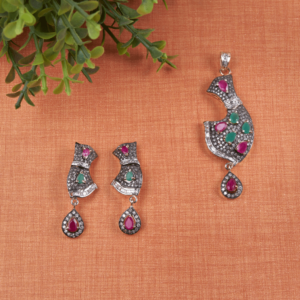 Crimson Ivy Pendant Set by Gift Elegantly features a diamond pendant with red and green stones and an oxidized finish. Ideal for special occasions.