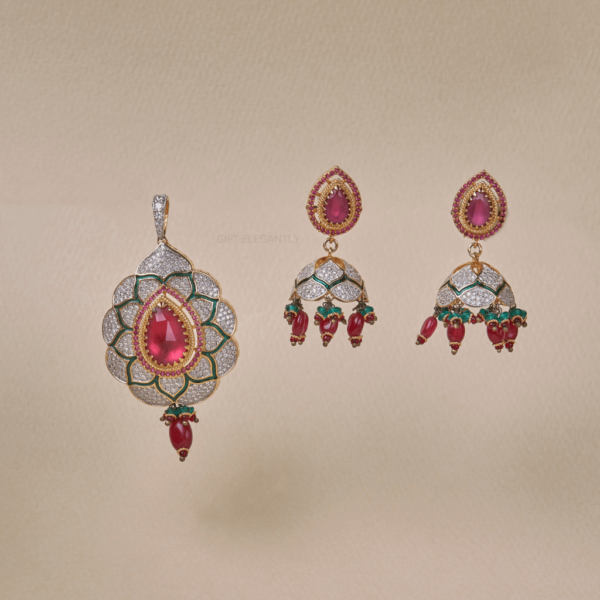 Crimson Bloom Pendant Set by Gift Elegantly features a diamond pendant with red stone and green enameling in a flower shape. Perfect for special occasions.