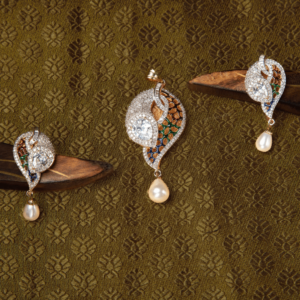 Make your special occasions unforgettable with the Diamond Pearl Polki Pendant Set from Gift Elegantly. Traditional design with Diamonds, Polki stones and pearl hanging. Treat yourself or gift to someone special.