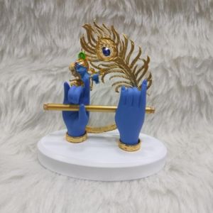 "Divine Krishna Flute Murti - marble dust idol with vibrant blue and gold accents and peacock feather backdrop"