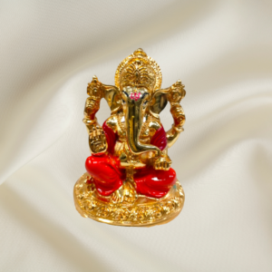 "Divine Radiance Ganesha Murti - 4-inch marble dust idol with gold coating and red enamel accents"