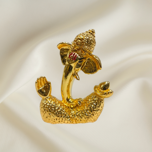 "Divine Joy Ganesha Murti - 3-inch marble dust idol with gold coating and colorful accents"