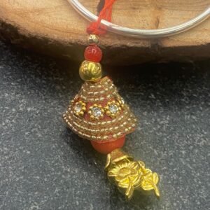 Handcrafted Golden Work Bhabhi Rakhi (गोल्डन वर्क भाभी राखी) with red thread and floral charm