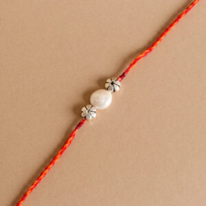 Pearl Silver Bead Rakhi with vibrant red thread