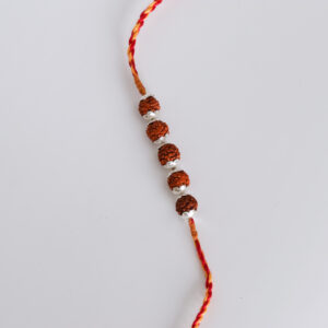 Elegant Rudraksh Silver Rakhi with vibrant red and yellow threads