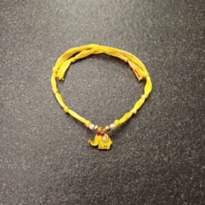 Sunny Yellow Elephant Rakhi with cute elephant charm on a yellow resham thread