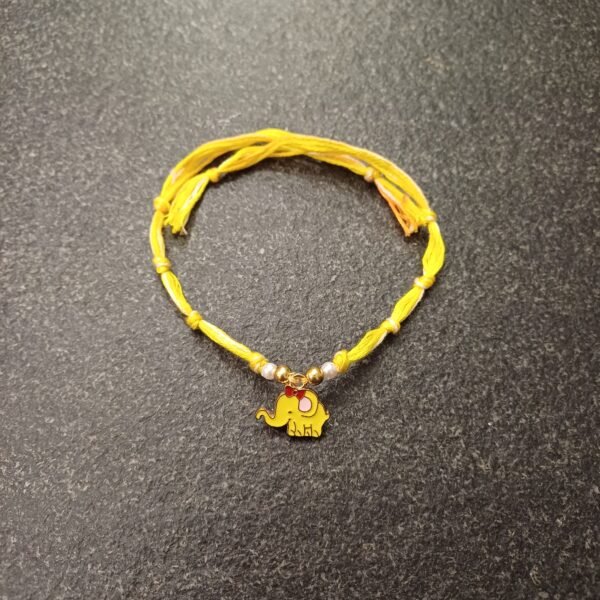 Sunny Yellow Elephant Rakhi with cute elephant charm on a yellow resham thread