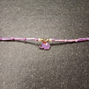 Pastel purple elephant charm rakhi on multicolor resham thread with bead accents