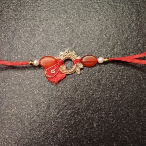 Crimson Loop Resham Rakhi with red thread and circular golden embellishment