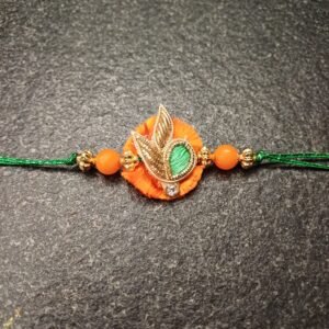 Harvest Glow Resham Rakhi with orange-green thread and golden motif for Raksha Bandhan