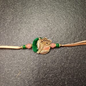 Peach Leaf Resham Rakhi with green resham thread, golden leaf design and bead detailing