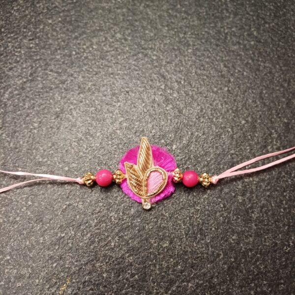 Rosy Leaf Resham Rakhi with pink base, gold detailing, and decorative pink beads for Raksha Bandhan