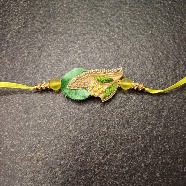 Floral Dew Resham Rakhi with embroidered green and yellow leaf motif and yellow thread