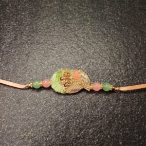 Royal Grace Resham Rakhi with pastel green and peach embroidery and golden motif on soft thread