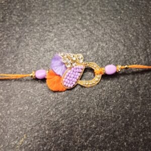 Royal Loop Resham Rakhi with purple crystals, orange resham, and infinity design