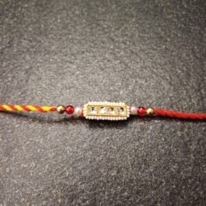 Regal Square Kundan Rakhi with pearl and red-golden beadwork on red-yellow thread