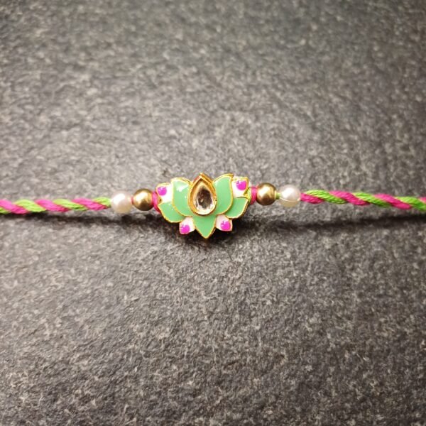 Handmade Green Lotus Kundan Rakhi with pink and green thread and kundan stone