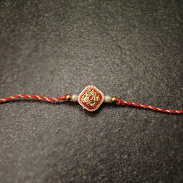 Regal Square Kundan Rakhi with red-yellow thread and golden kundan center
