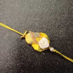 Yellow floral embroidered rakhi on resham thread with rose blossom charm