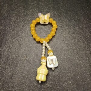 Butterfly Charm Kids Bracelet with yellow beads, bottle, and butterfly design
