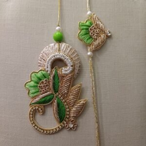 Handmade embroidered green and gold rakhi pair for bhai and bhabhi with floral design