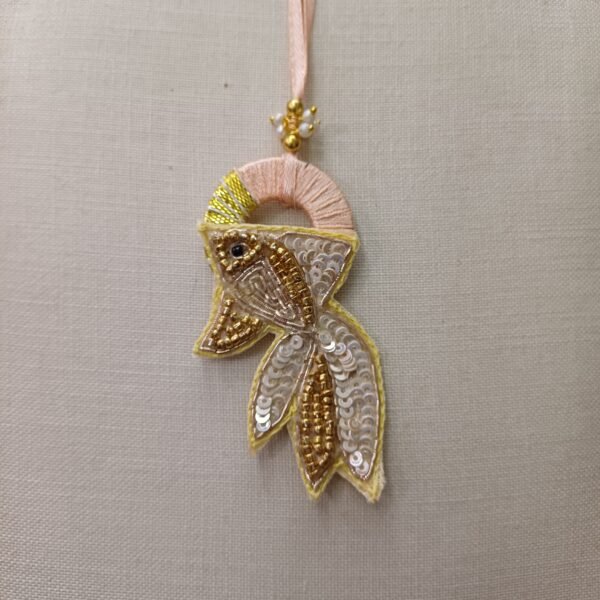 Golden Fish Embroidery Rakhi with pastel peach loop and sequined golden fish design