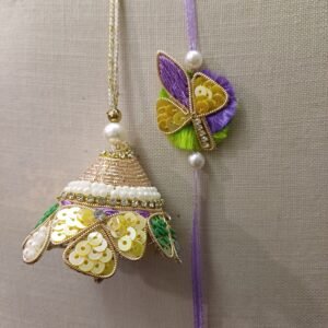 Lilac Shine Pair Rakhi with sequin floral bell and butterfly design for bhaiya and bhabhi – handcrafted festive rakhi set