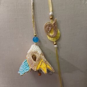 Handmade Pearl Glory Pair Rakhi for Bhai and Bhabhi in blue, gold, and pearl design with tassel and embroidery