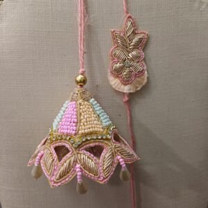 Elegant Pastel Rakhi Pair with dome-shaped bead design for brother and bhabhi