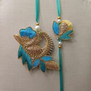 Teal Bloom Pair Rakhi featuring floral embroidery and stone accents for brother and bhabhi