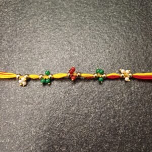 Multicolor Bead Moli Rakhi with red, yellow thread and clustered beads
