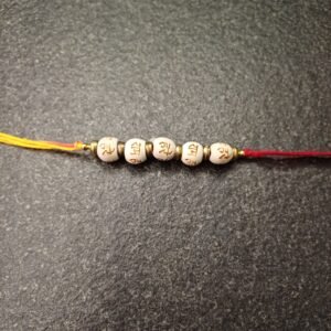 Hare Ram Moli Rakhi with white sacred beads on red-yellow thread