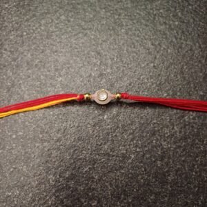 Minimal Stone Moli Rakhi with red-yellow thread and single stone in oval setting