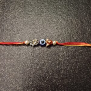 Evil Eye Moli Rakhi with Hamsa charm, pearls and red-yellow thread