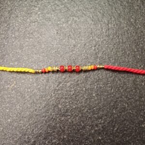 Crimson Bead Moli Rakhi with red and orange beads on moli thread