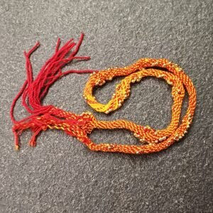 Traditional dozen moli rakhi set with red and yellow sacred threads and golden bead detailing