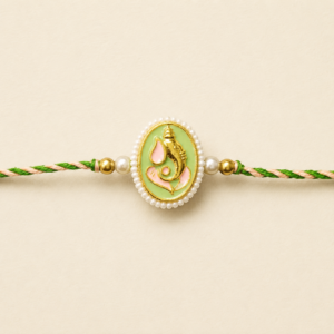 Auspicious Ganesha pearl Bhai Rakhi with green and peach braided thread
